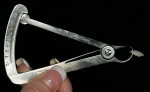Figure 10  Micrometer measuring the thinness of the veneer.