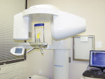 Figure 5 A typical CBCT unit closely resembles a conventional panoramic machine.