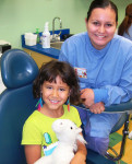 Figure 4 Dental assistant Jessica Rivas with a smiling patient from Children’s Dental Services.