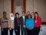 Buffalo students presented a check to Dr. John Nasca, President of the 8th District Dental Society.