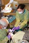 Michelle Binder works with a patient.