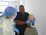 Phillip Manning demonstrates a technique for a student.
