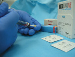 Figure 3. Automix syringe of non-eugenol zinc oxide being used to fill the crown with temporary cement prior to placement.
