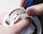 Removing a milled multiple-unit bridge
from a zirconia puck.