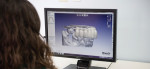 A technician works with CAD/CAM Software.