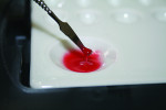 Fig 4. A nickel-sized quantity of Ceramage F-Gum-R (flowable red) is placed onto a mixing
pallet and diluted with an equal quantity of Lite Art clear liquid.