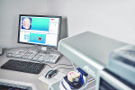 Fig 1. A scan and design station at Jesse and Frichtel Dental Labs includes a NobelProcera scanner.