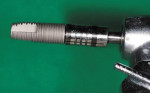 Figure 8  HG II implant (Hiossen) on the handpiece ready to be placed into the site.