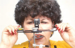 Figure 7  Using an adjustable nasion relator and level gauge on the face bow.