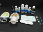 Figure 11   Dentures have been invested and the wax eliminated to prepare for intrinsic colorizing of gingival base.