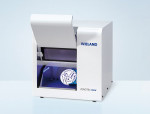 Figure 13  About the size of a microwave oven, the ZENOTEC Mini from Wieland Dental Systems sports four-axis milling geometry, an automatic tool change and measurement device, and can mill zirconia, acrylic, and wax materials.
