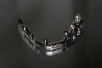 Figure 3  A prototypical Montreal-style SRH bar with a convex, mirror-polished intaglio surface. Note that bar interfaces with two different implant systems and three different platforms on the same arch.