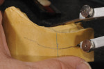 Modified dividers utilized to transfer the maxillary ridge to the side of the cast to aid in determining the stop line.