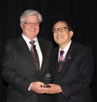 Dr. Baldwin Marchack (right) presents Robert Kreyer, CDT (left) with the American Prosthodontic Society's Rudd Award.