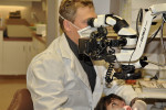 Figure 1 The author at work with a dental operating microscope.
