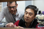 Fig 1. Jack Marrano, CDT, works on a case with Jimmy Loo of Absolute Dental’s Art Team. Marrano believes the best way to gain technicians’ trust and respect is to work alongside them.