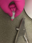 A pink, low-viscosity glass-ionomer sealant was activated and mixed for 10 seconds in a capsule mixer.